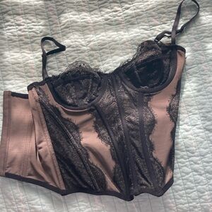 Out from under black corset